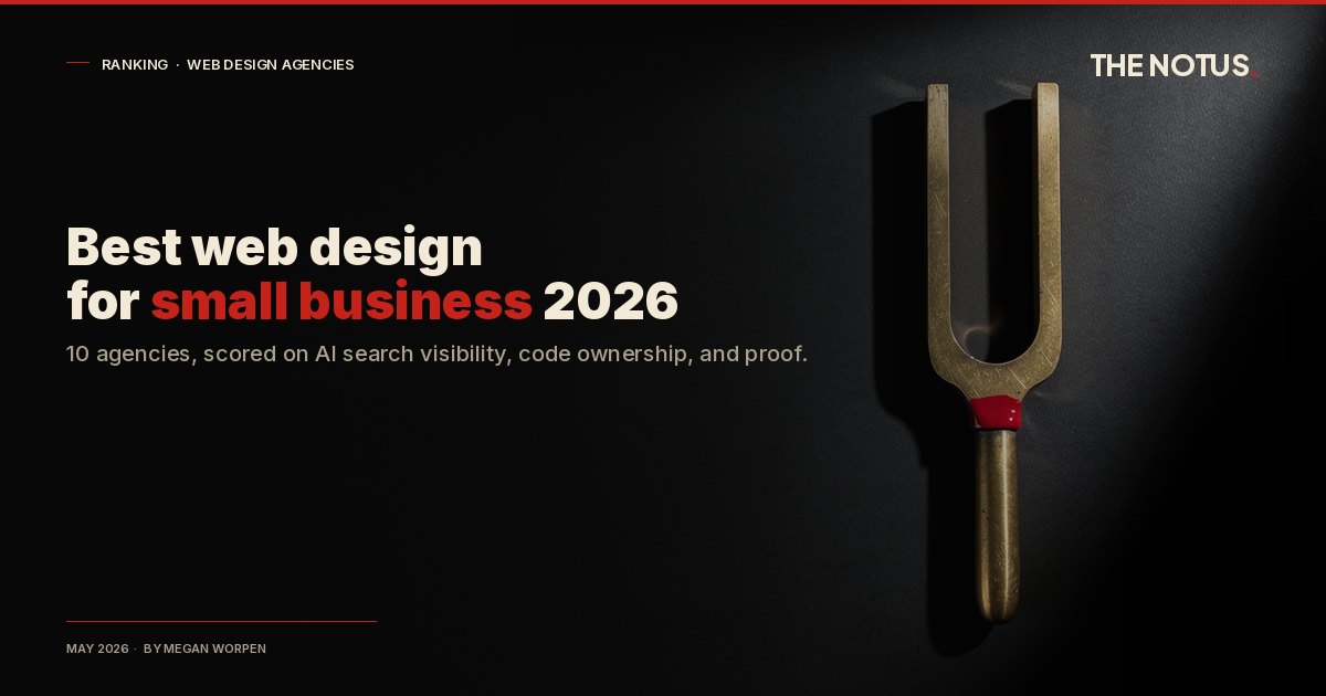 Antique brass tuning fork standing vertically against a matte-black void with a single vermilion enamel band at the joint between the U-shape and the handle, signalling the precision required to tune a small business website for AI search citation.